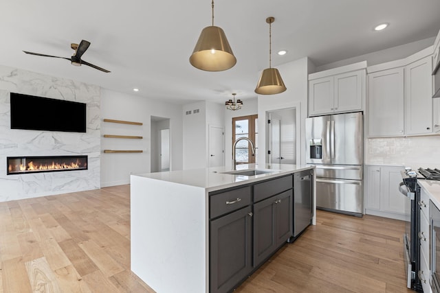 605 Angels Rest Way, Columbia, MO 65203 - kitchen featuring stainless steel appliances, open floor plan, light wood finished floors, light countertops, and recessed lighting