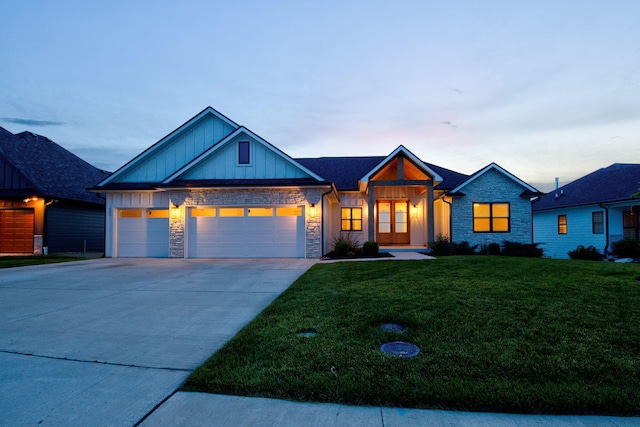 605 Angels Rest Way, Columbia, MO 65203 - craftsman-style home with board and batten siding, a garage, concrete driveway, a lawn, and stone siding