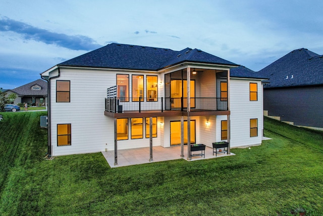 605 Angels Rest Way, Columbia, MO 65203 - rear view of house featuring a patio, a yard, a shingled roof, and a balcony