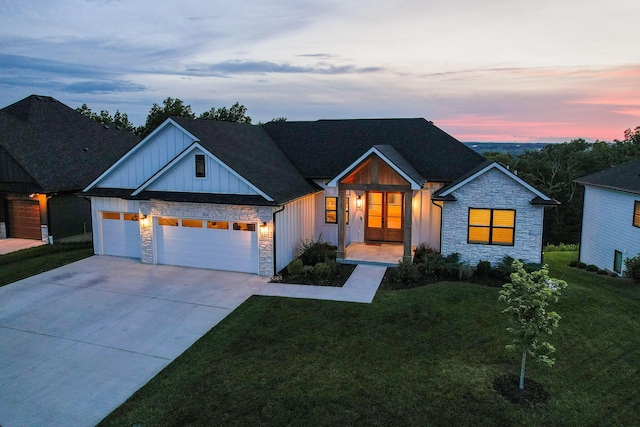 605 Angels Rest Way, Columbia, MO 65203 - modern inspired farmhouse featuring stone siding, board and batten siding, concrete driveway, a garage, and a lawn