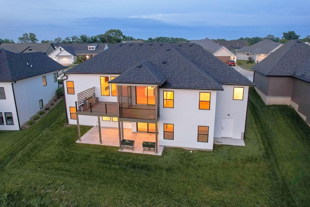 605 Angels Rest Way, Columbia, MO 65203 - back of house featuring a patio, a shingled roof, a lawn, and a residential view