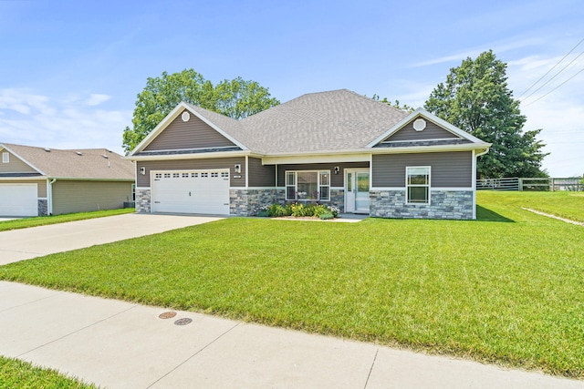 15409 Allegiance Ave, Ashland, MO 65010 - craftsman inspired home with stone siding, a garage, concrete driveway, and roof with shingles