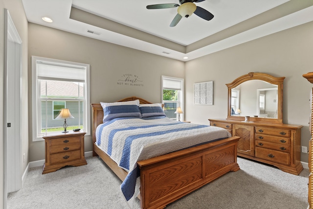 15409 Allegiance Ave, Ashland, MO 65010 - bedroom featuring light colored carpet, a tray ceiling, ceiling fan, and recessed lighting
