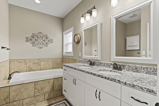 15409 Allegiance Ave, Ashland, MO 65010 - full bathroom featuring double vanity, a garden tub, and tile patterned flooring