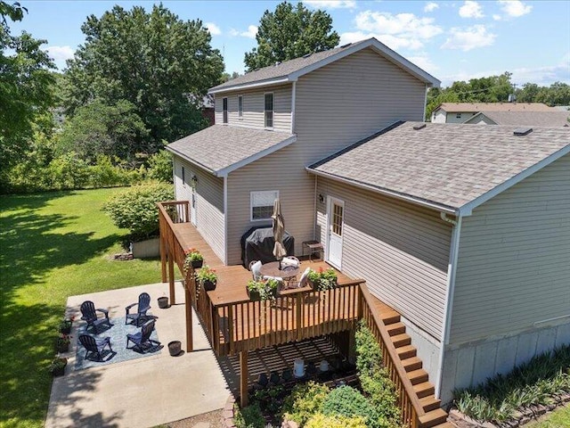 205 Johnson Ct, Ashland, MO 65010 - back of property with a shingled roof, a deck, a lawn, a patio, and stairs