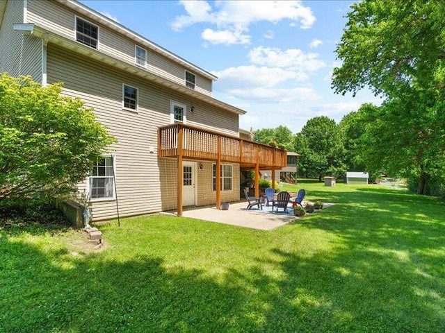 205 Johnson Ct, Ashland, MO 65010 - back of house with a patio area, a yard, and a wooden deck