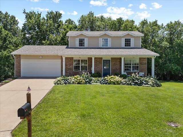 205 Johnson Ct, Ashland, MO 65010 - traditional-style house featuring a garage, brick siding, driveway, and a front lawn