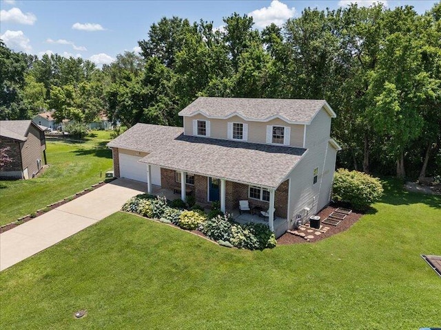 205 Johnson Ct, Ashland, MO 65010 - traditional-style home with driveway, a front yard, a shingled roof, a porch, and a garage