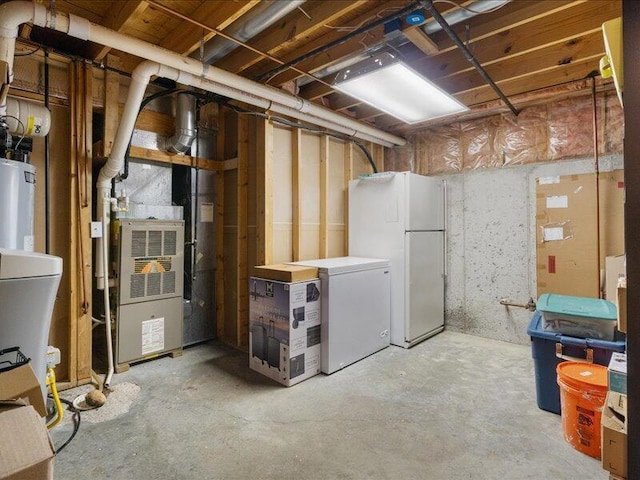 205 Johnson Ct, Ashland, MO 65010 - unfinished basement with freestanding refrigerator, refrigerator, and water heater