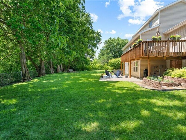 205 Johnson Ct, Ashland, MO 65010 - view of grassy yard featuring a patio and a wooden deck