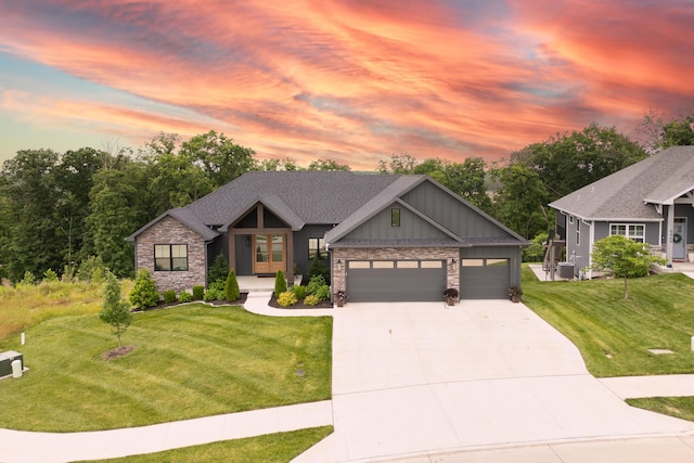 5413 Briar Rose Ct, Columbia, MO 65203 - view of front of house featuring concrete driveway, a yard, stone siding, and board and batten siding