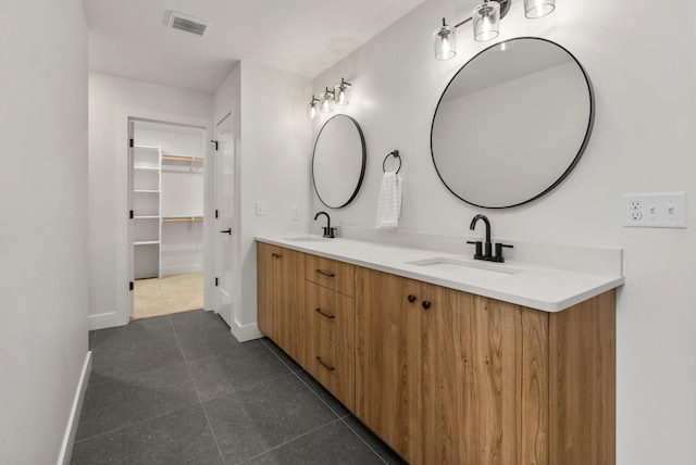 5413 Briar Rose Ct, Columbia, MO 65203 - bathroom featuring double vanity, a spacious closet, and tile patterned floors