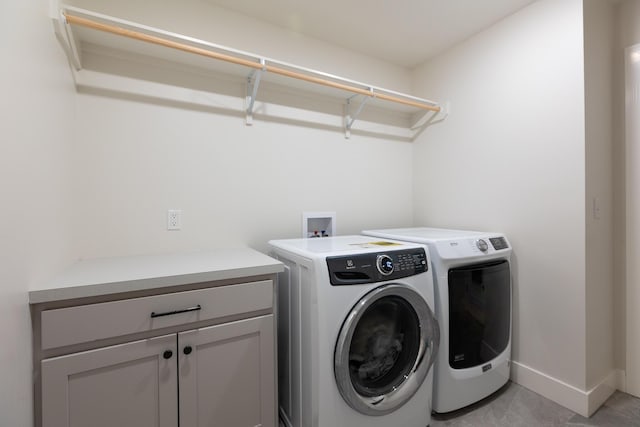 5413 Briar Rose Ct, Columbia, MO 65203 - laundry area with washer and dryer and cabinet space