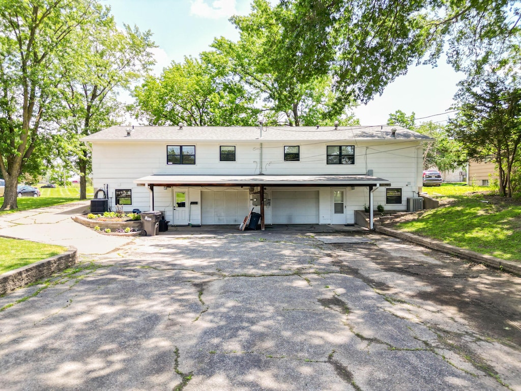 3405 Balboa Ln Unit A-B, Columbia, MO 65203 - rear view of property with a garage and driveway