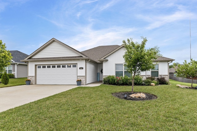 3515 Goldenwood Dr, Columbia, MO 65202 - view of front of property with an attached garage, driveway, stone siding, and board and batten siding