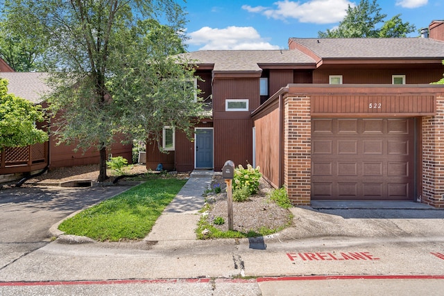 522 Huntridge Dr, Columbia, MO 65201 - view of front of property with a shingled roof and brick siding