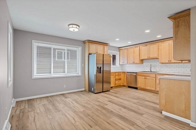 522 Huntridge Dr, Columbia, MO 65201 - kitchen with stainless steel appliances, light brown cabinets, light wood-style flooring, light countertops, and recessed lighting