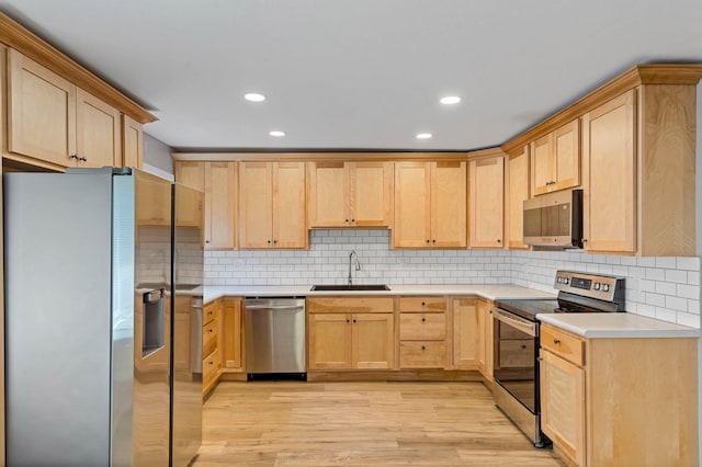 522 Huntridge Dr, Columbia, MO 65201 - kitchen with stainless steel appliances, light brown cabinets, light wood-style floors, and recessed lighting