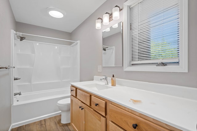 522 Huntridge Dr, Columbia, MO 65201 - bathroom featuring vanity, shower / bathtub combination, and wood finished floors