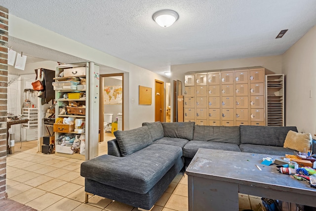 2808 Pine Dr, Columbia, MO 65202 - living room with tile patterned flooring and a textured ceiling