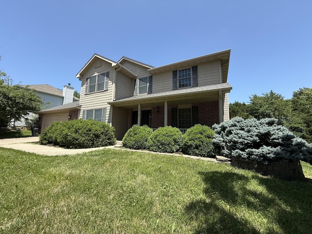 4413 Shoram Ct, Columbia, MO 65203 - traditional-style house with an attached garage, a front lawn, brick siding, and a porch
