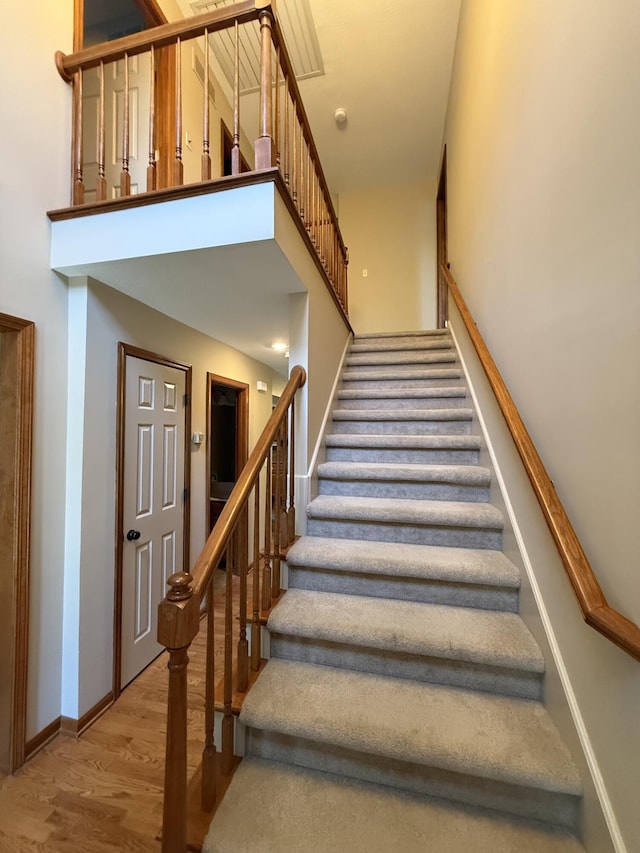 4413 Shoram Ct, Columbia, MO 65203 - stairway with wood finished floors and a high ceiling