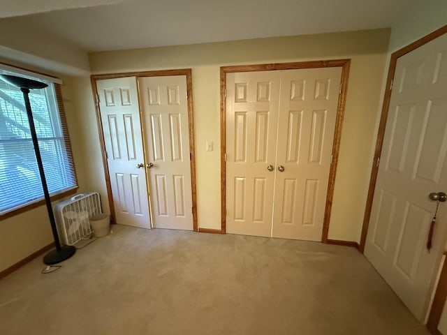 4413 Shoram Ct, Columbia, MO 65203 - unfurnished bedroom with multiple closets and light colored carpet