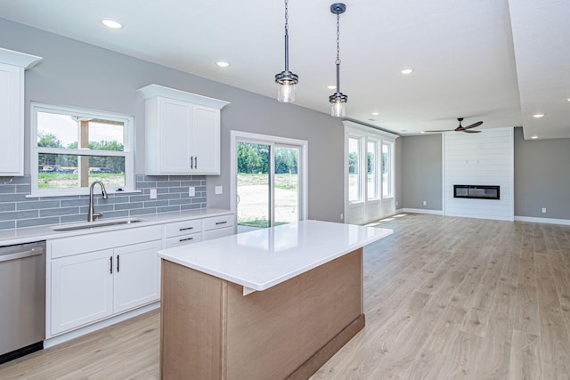 3321 Gray Birch Dr, Columbia, MO 65202 - kitchen featuring dishwasher, light countertops, ceiling fan, decorative backsplash, and recessed lighting