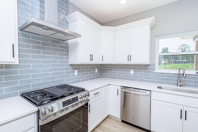 3321 Gray Birch Dr, Columbia, MO 65202 - kitchen with stainless steel appliances, wall chimney range hood, and light countertops