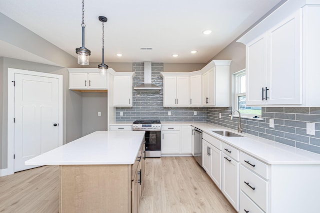 3321 Gray Birch Dr, Columbia, MO 65202 - kitchen featuring stainless steel appliances, wall chimney range hood, light wood-type flooring, a center island, and recessed lighting