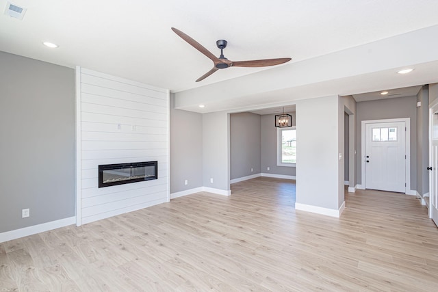 3321 Gray Birch Dr, Columbia, MO 65202 - unfurnished living room with ceiling fan, a fireplace, light wood finished floors, healthy amount of natural light, and recessed lighting