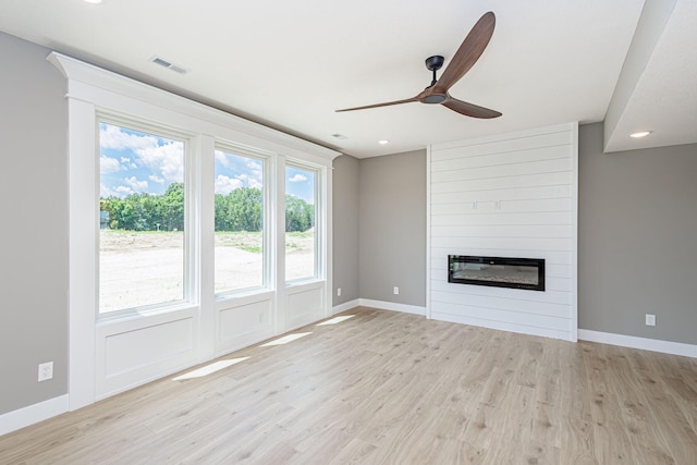 3321 Gray Birch Dr, Columbia, MO 65202 - unfurnished living room featuring a ceiling fan, recessed lighting, light wood-style flooring, and a large fireplace