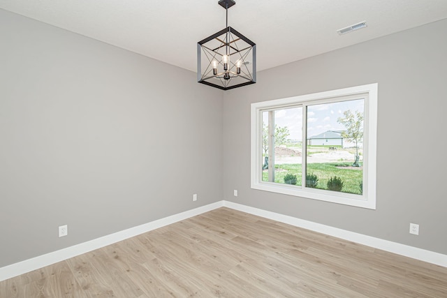 3321 Gray Birch Dr, Columbia, MO 65202 - empty room with a chandelier and light wood-style floors