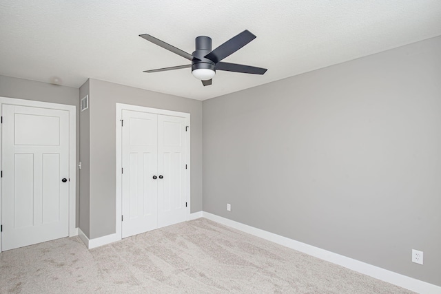 3321 Gray Birch Dr, Columbia, MO 65202 - unfurnished bedroom featuring a closet, carpet floors, and ceiling fan