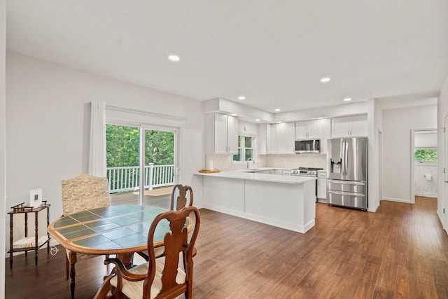 3348 S Old Ridge Rd, Columbia, MO 65203 - dining space featuring dark wood-style flooring, plenty of natural light, and recessed lighting
