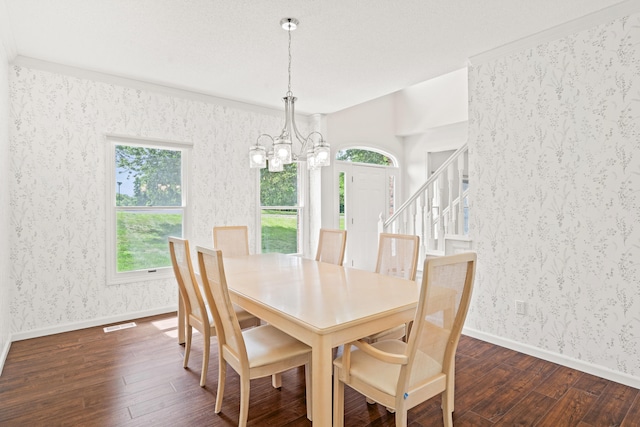 3348 S Old Ridge Rd, Columbia, MO 65203 - dining room with dark wood-style floors, a chandelier, wallpapered walls, and stairs