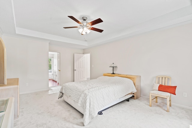 3348 S Old Ridge Rd, Columbia, MO 65203 - bedroom with a raised ceiling, light colored carpet, arched walkways, and ceiling fan