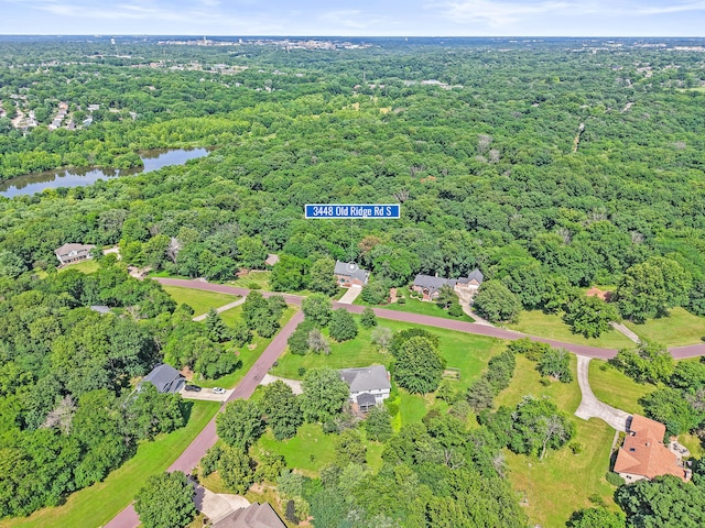 3348 S Old Ridge Rd, Columbia, MO 65203 - aerial overview of property's location with a nearby body of water and a heavily wooded area