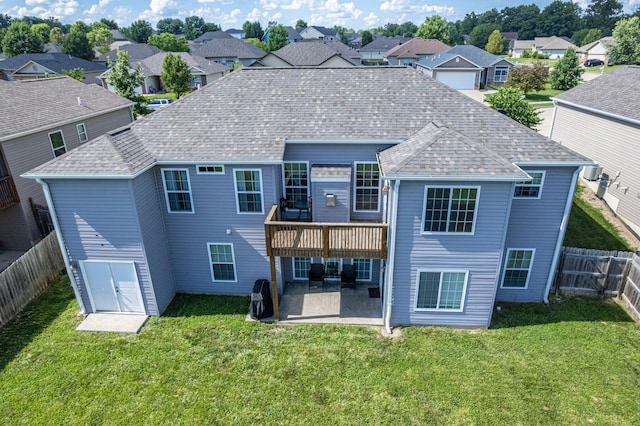 5808 Islip Dr, Columbia, MO 65201 - back of property featuring a patio area, a residential view, a fenced backyard, roof with shingles, and a wooden deck
