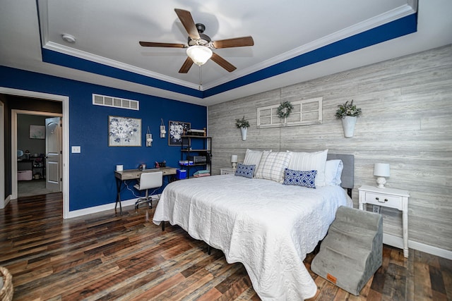 5808 Islip Dr, Columbia, MO 65201 - bedroom featuring a raised ceiling, an accent wall, a desk, wood finished floors, and a ceiling fan
