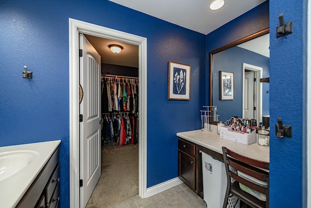 5808 Islip Dr, Columbia, MO 65201 - bathroom with vanity and a spacious closet