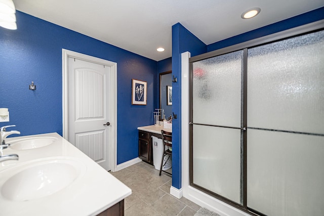 5808 Islip Dr, Columbia, MO 65201 - full bath with double vanity, a stall shower, tile patterned floors, and recessed lighting