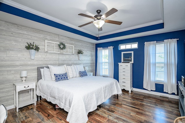 5808 Islip Dr, Columbia, MO 65201 - bedroom with an accent wall, a raised ceiling, crown molding, and wood finished floors