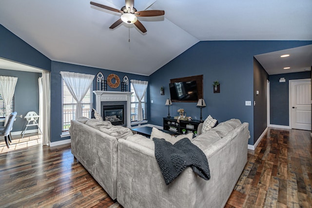 5808 Islip Dr, Columbia, MO 65201 - living area featuring vaulted ceiling, wood finished floors, a ceiling fan, and a glass covered fireplace