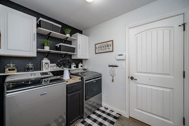 5808 Islip Dr, Columbia, MO 65201 - laundry area with washer and clothes dryer, cabinet space, and light tile patterned flooring