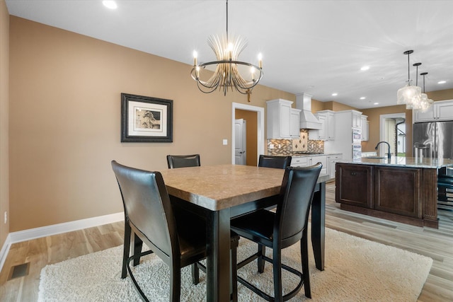 6406 Crooked Switch Ct, Columbia, MO 65201 - dining space featuring a chandelier, light wood-type flooring, and recessed lighting