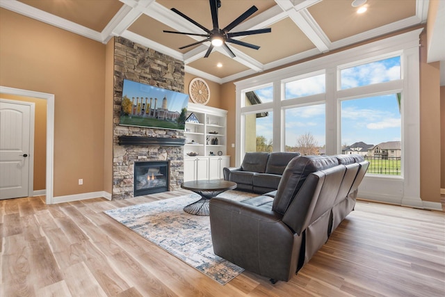 6406 Crooked Switch Ct, Columbia, MO 65201 - living room featuring coffered ceiling, crown molding, ceiling fan, a stone fireplace, and beam ceiling