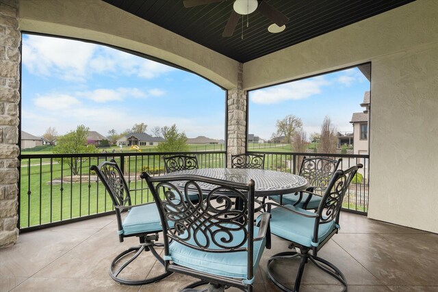 6406 Crooked Switch Ct, Columbia, MO 65201 - view of patio featuring a ceiling fan, outdoor dining area, and a residential view