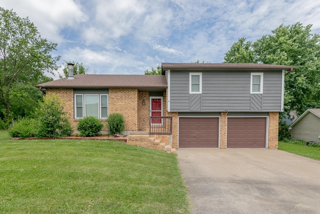 2109 Bridgewater Dr, Columbia, MO 65202 - split level home featuring brick siding, a garage, and a front yard
