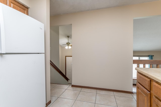 2109 Bridgewater Dr, Columbia, MO 65202 - hall with light tile patterned floors and an upstairs landing